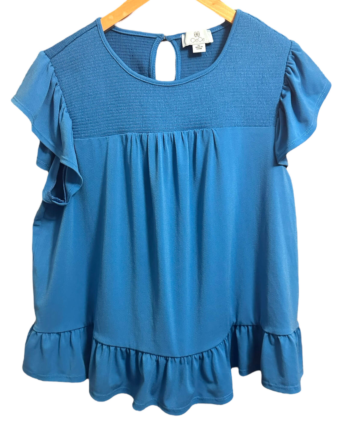 Warm Spring CECE ocean blue smocked ruffle hem top