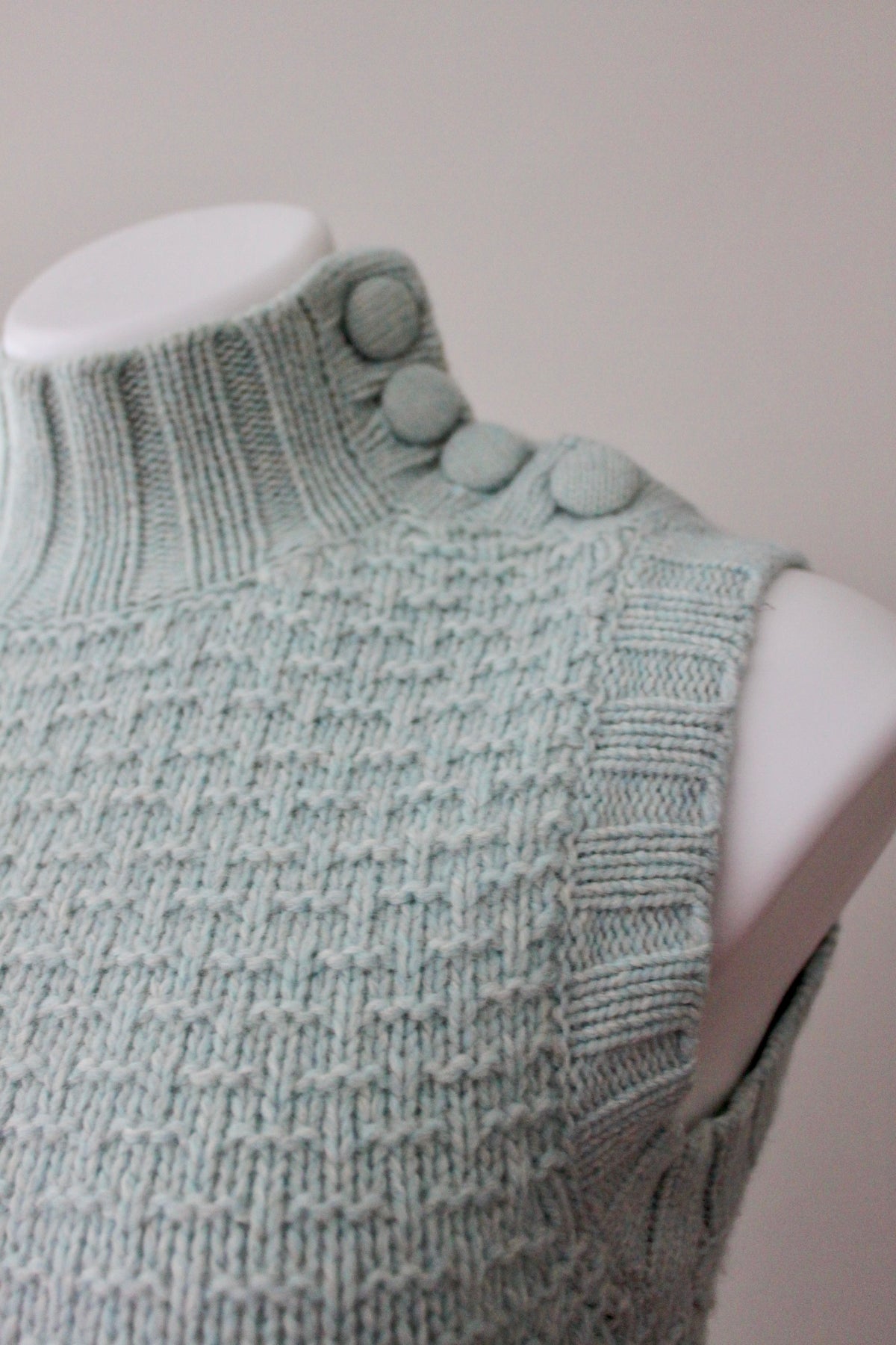 EMS button Soft Summer sleeveless dusty sage turtleneck sweater detail